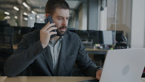 businessman on phone call and laptop