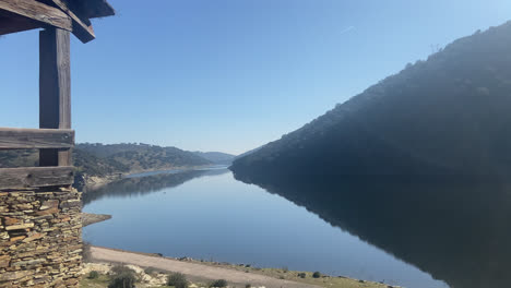 Amazing-shot-of-a-stunning-lake-located-between-mountains-in-Ribera-del-Duero-in-Spain-at-daylight