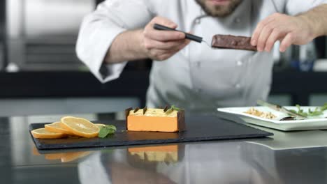 chef making cake at workplace. closeup baker putting dessert in slow motion