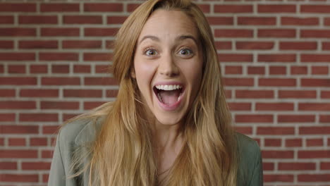 portrait of young blonde woman looking suprised feeling happy cheerful