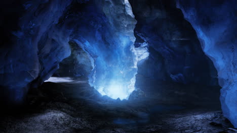brilliant blue light illuminating an intricate ice cave formation in nature
