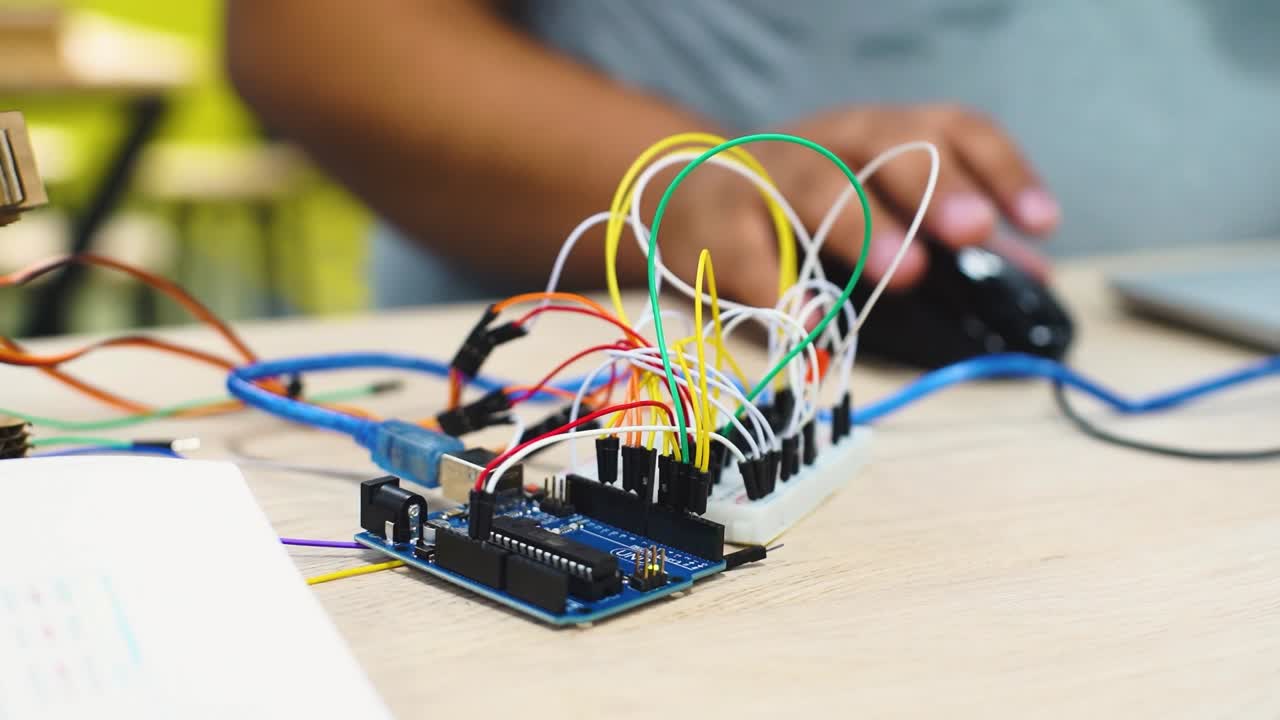 electric circuit with colored wires connected to raspberry pi to control robotics