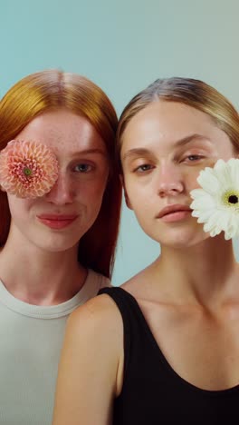 two women with flowers