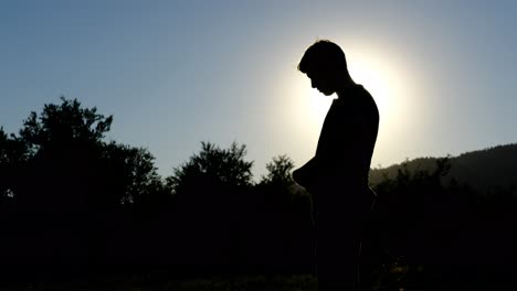 islamic praying silhouette in garden