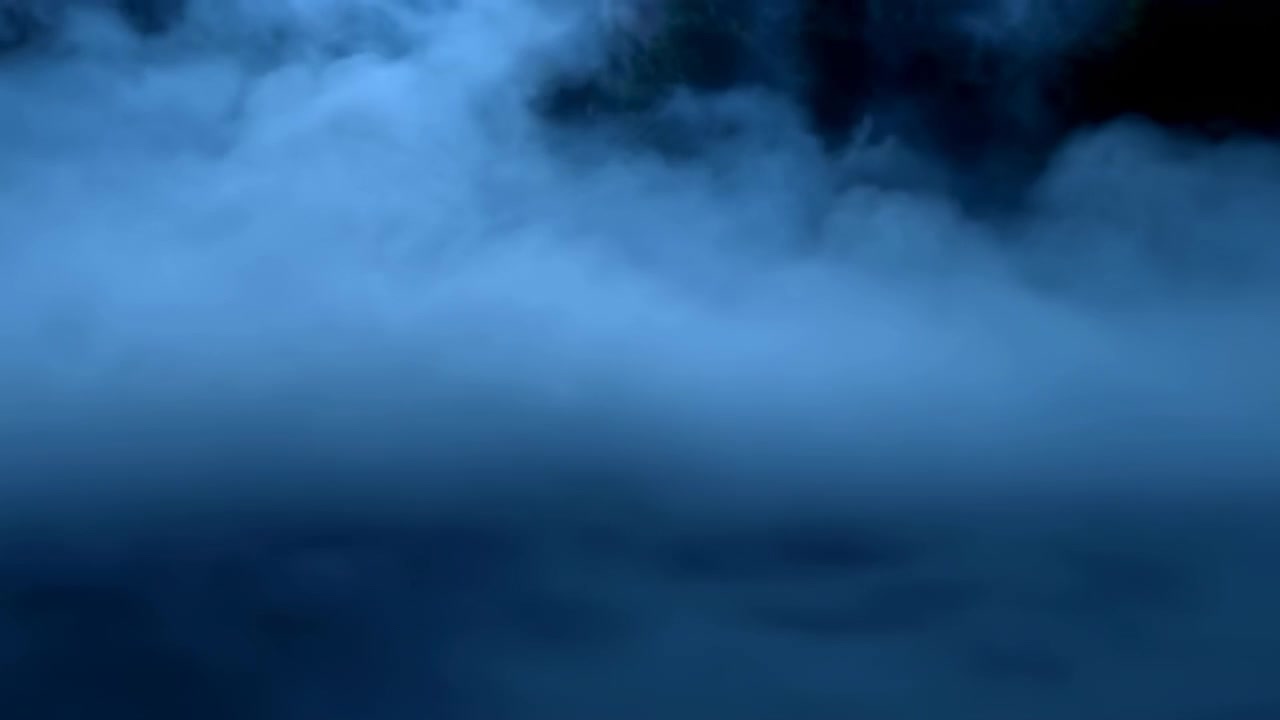 Wide panoramic scene with low fog filling lower area and dense navy cloud formations above, creating soft diffuse light, calm mood, smooth tonal shifts, strong atmospheric depth, and spacious