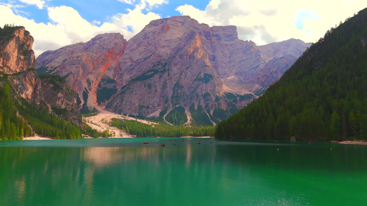 Famous for its picturesque beauty, Lake Braies attracts travelers with its charming wooden boat rentals and tranquil ambiance, perfect for a relaxing day on the water.