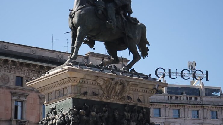 Statue in Milan with Gucci sign