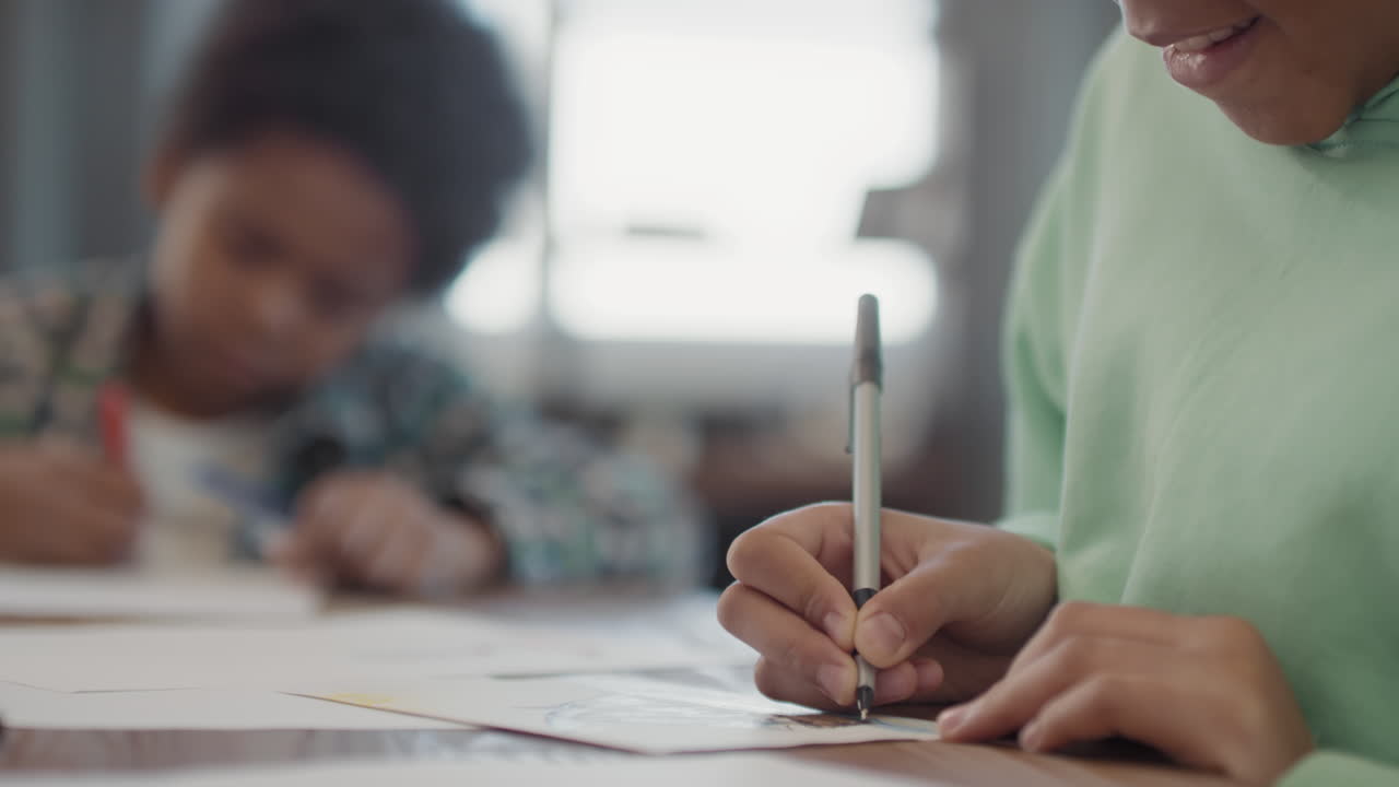 Close Up Of Afro Girl Drawing Picture Of Ship