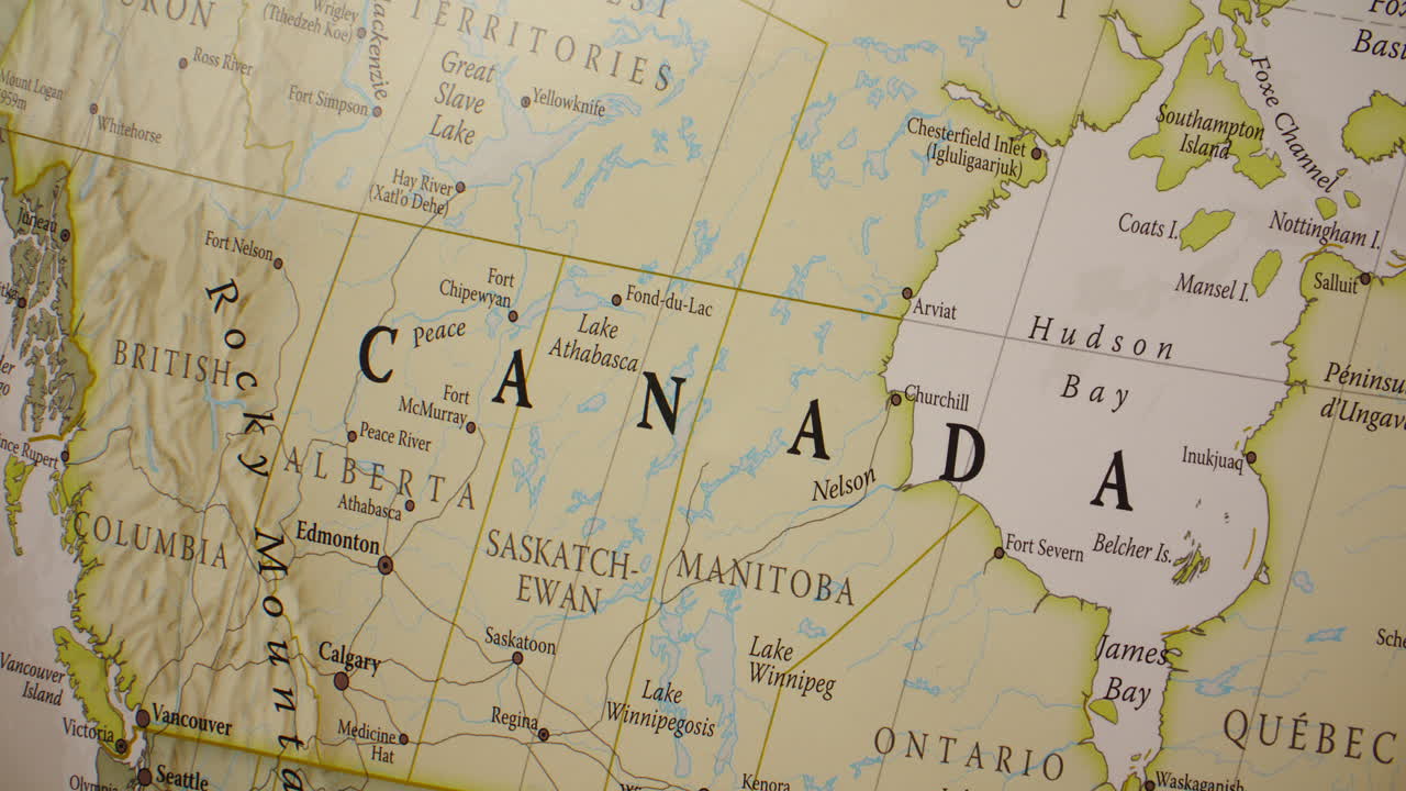A close-up view of a detailed map of Canada, showing its provinces, territories, and major cities