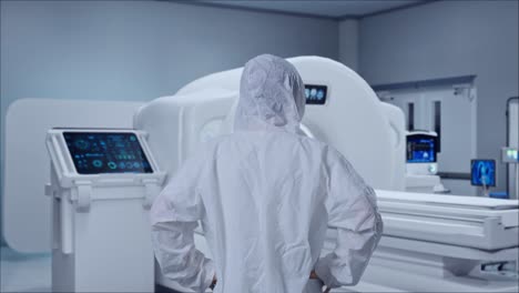 back view of asian male scientist putting hands on his hip and looking around with mri machine in the hospital