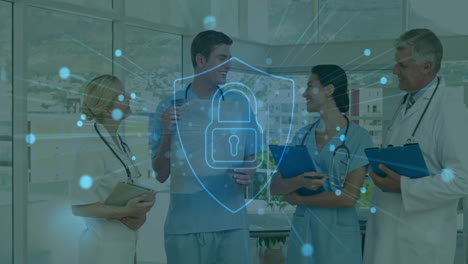 medical professionals discussing patient care with cybersecurity animation over them