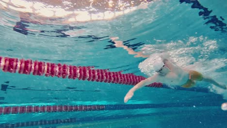 swimmer in action during a backstroke race.