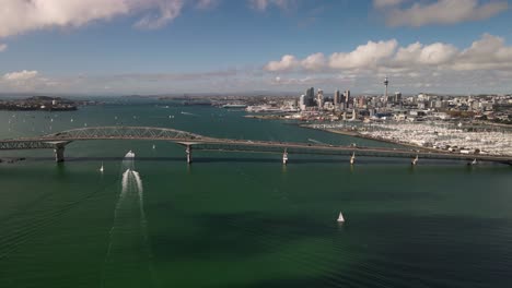 aerial pull back from auckland harbour bridge