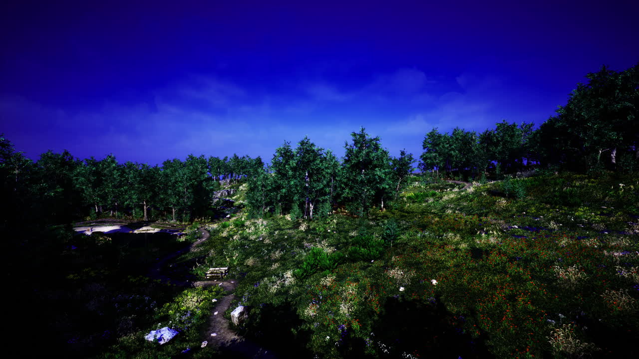 Lush green forest landscape under a vivid blue sky at twilight