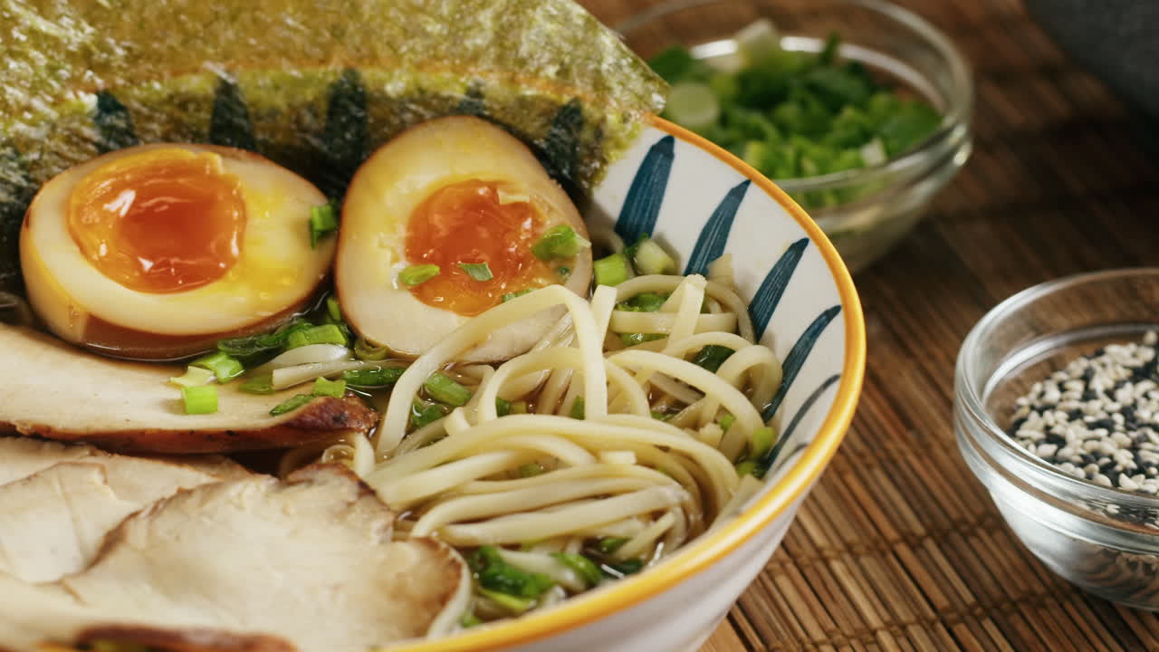 Close-up of delicious ramen with egg, pork, and seaweed