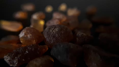 natural baltic amber stones on a black background-5