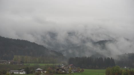 moving fog over forest during morning hours in austrian alps, tyrol