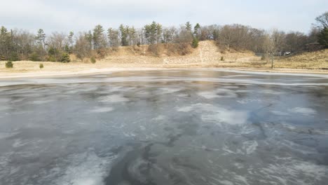melting ice in january over dune harbor park