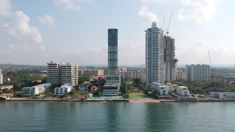 aerial view image of tall buildings by the sea.