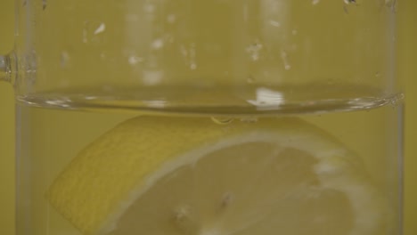 Lemon-slice-falls-into-water-in-SLOW-MOTION