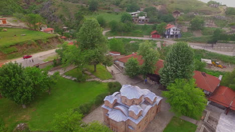 aerial view of luxury hotel with villas and pool in tropical jungle and palm trees