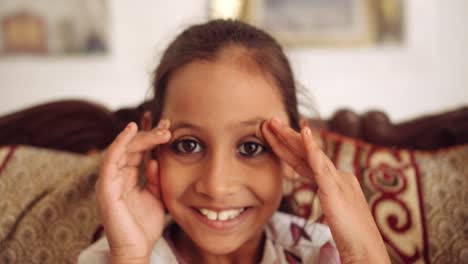 portrait of an indian child at home during coronavirus lockdown
