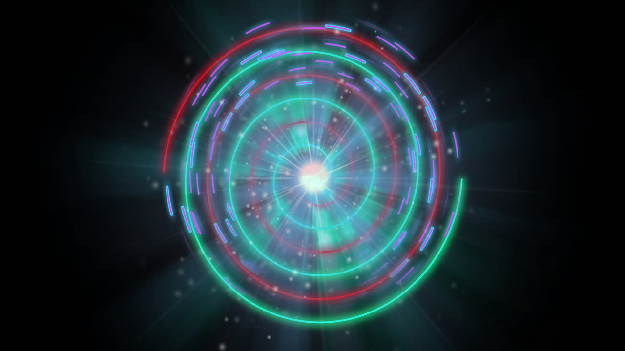 Animation of colorful circular light patterns forming spiral on dark background