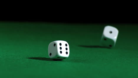 hand rolling white dice