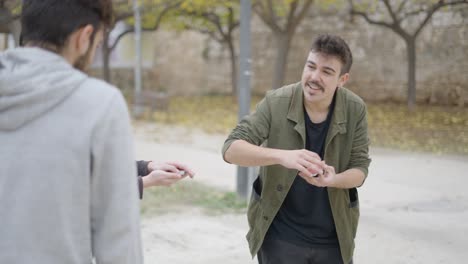 street magician performing card trick