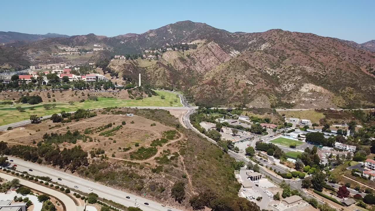 Aerial View of a Suburban Area with Mountains in the Background