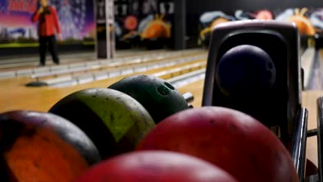 bowling alley scene with colorful bowling balls