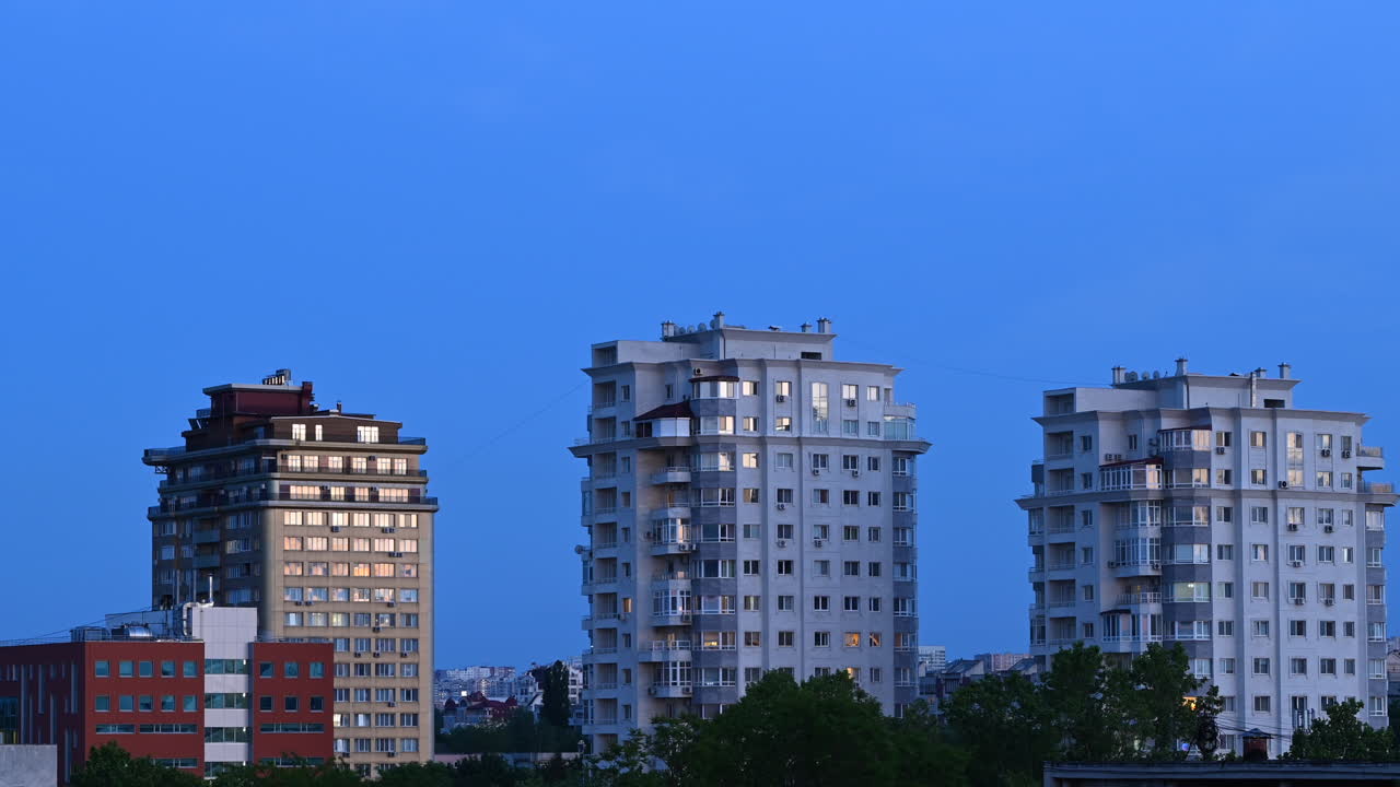 Time lapse of modern residential buildings under soft evening light and cloudy sky