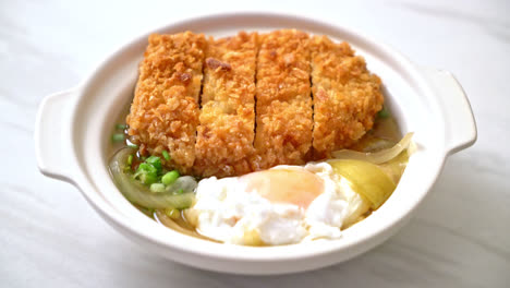 japanese fried pork cutlet with onion soup and egg - asian food style