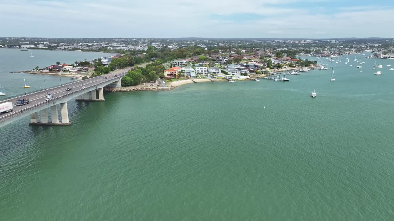 Overhead view of the Captain Cook Bridge at Sans Souci with boats and houses beyond