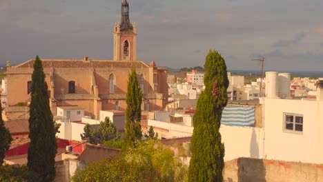 high angle shot over an old gothic church in valencian community at sagunto, spain on a sunny day