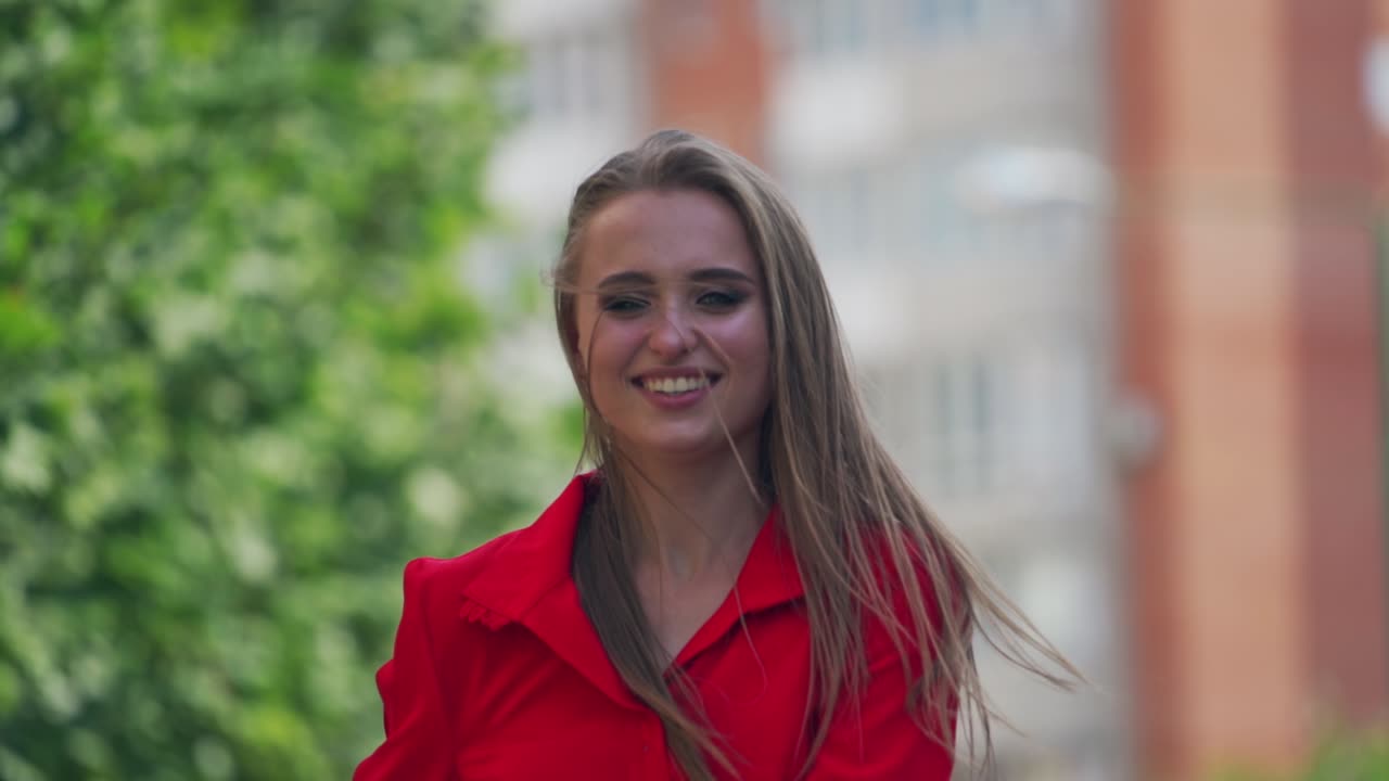 Woman walking in the street. Young beautiful woman smilling and walking in the town