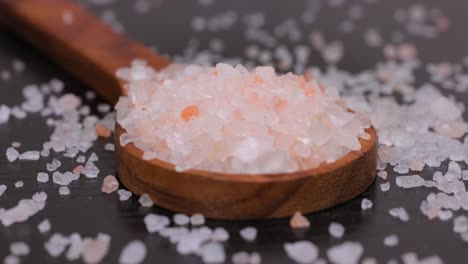 himalayan pink salt in a wooden is used to flavor food. due mainly to marketing costs, pink himalayan salt is up to twenty times more expensive than table or sea salt.