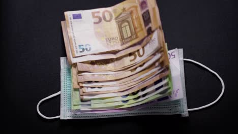 flying euro banknotes and mouth mask. storm. financial market disaster concept. recession. collapse.