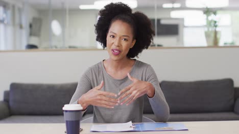 african american businesswoman having video call at office, slow motion