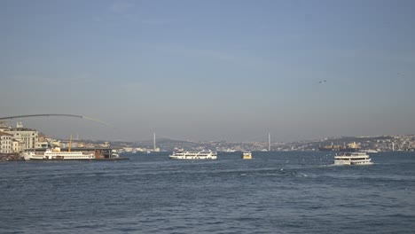 fishermen fishing on the bosphorus, galata bridge, with a sea view