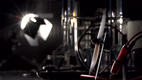 Small-electric-fan-powered-by-the-light-seen-in-the-background