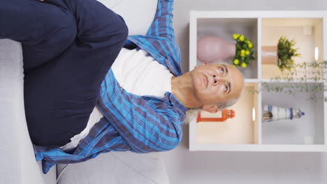 vertical video of old man with forgetfulness problem.