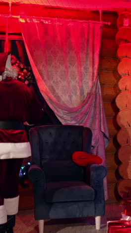 santa claus in house at night. santa claus in beautiful room during christmas night. vertical video