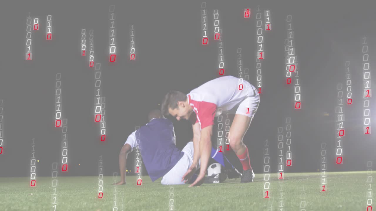 흰색 유니폼을 입은 선수가 잔디 위에서 공을 컨트롤하며 태클을 피하고, 상대를 일으켜 스포츠 정신을 보여주고 있어요.