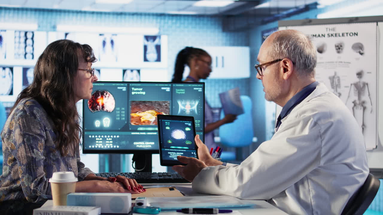 Vertical Video Meeting between doctor and patient to examine MRI scan showing a tumor