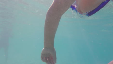 underwater footage of kid snorkeling at kalamata beach, greece