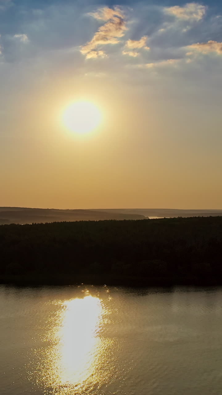 Warm colors reflect the water surface. Colorful sky and colorful water in lake reflected in evening