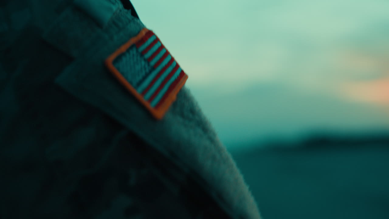 American Flag Memorial Day on a Soldiers Arm on the Beach After Sunset