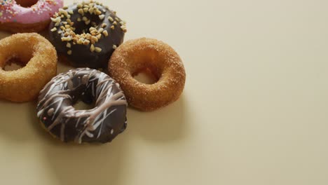 Video-of-donuts-with-icing-on-white-background