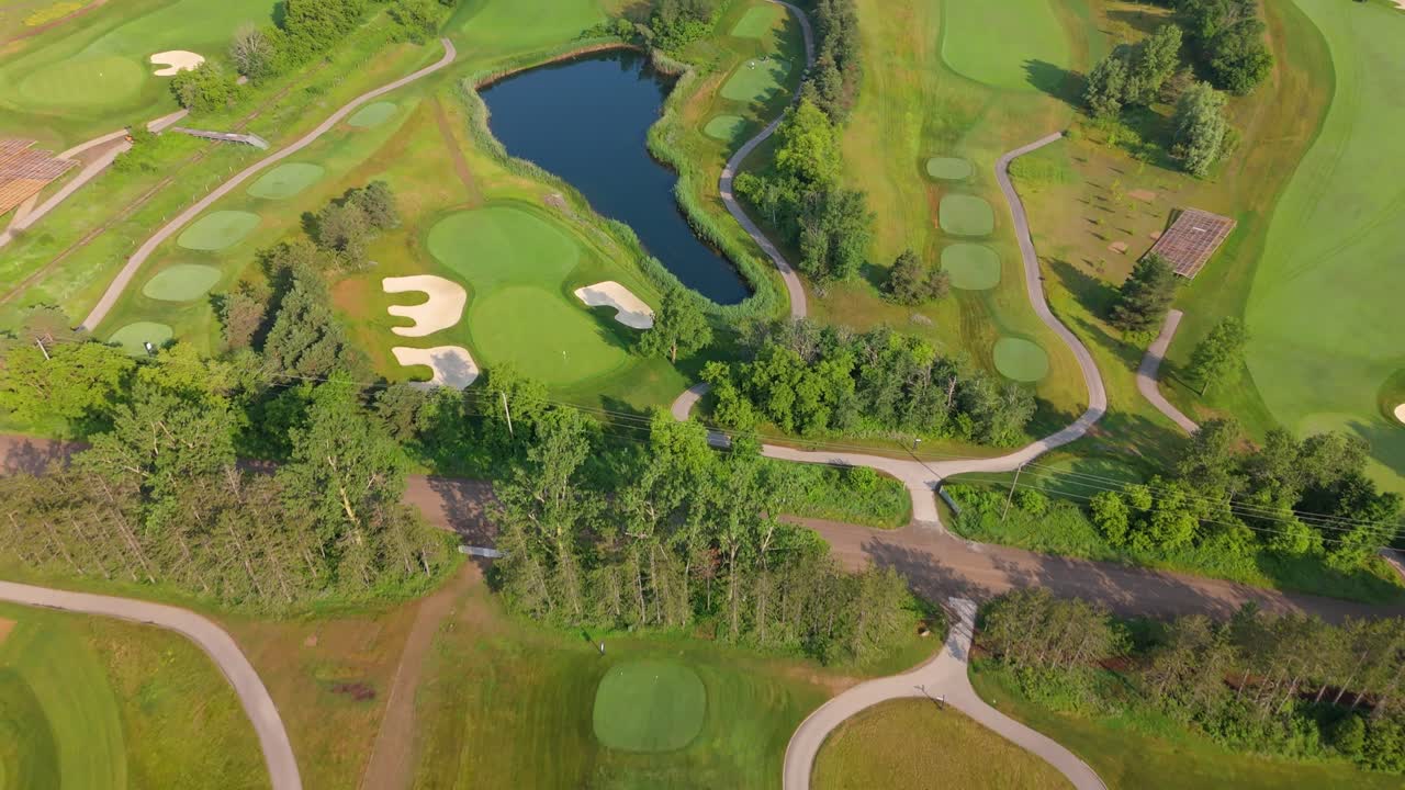 Aerial angled overview of TPC golf course fairways and bunkers in Caledon, Ontario